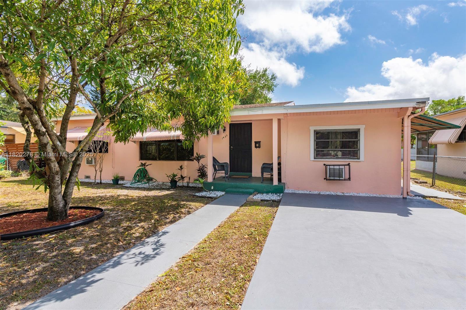 This property is located in a duplex zone and easily be converted to a duplex. It currently has 4 BR and 3 baths. It is close to schools, shopping centers, restaurants, minutes to the beaches and approximately twenty minutes to downtown and Seminole Hardrock. There is a huge backyard with fruits , fence, adequate space for a pool of your satisfaction and on ,. Owner occupied; please do not disturb the occupants. This property is one of a kind and won't last. Make your offers now!