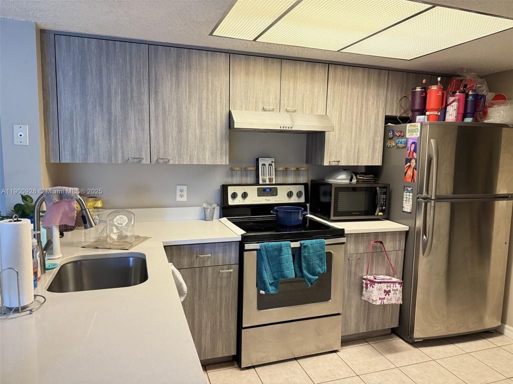 Photo of 5015 Wiles Rd #207, Coconut Creek, FL 33073 (MLS # A11900928)