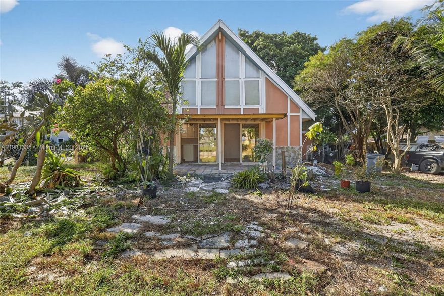 Bright and Airy.... Unique 3 Bedroom, 2 Bathroom, A-Frame Home on an Oversized Lot in Central Lake Worth. Features a Remodeled Kitchen, Contemporary White Cabinetry, Quartz Countertops, Undermount Sink, Stainless Steel Range and Microwave, Large Cooking Island/Serving Bar, Spacious Master Bedroom, Updated Master Bath, Newer Vanity, Elongated Toilet, Walk-in Shower, Custom Tilework, Generous Guest Rooms, Vaulted Ceilings, Plank, Tile and Parquet Flooring, Fireplace, Expansive Open-Air Pavered Patio, Storage Room, Standalone Shed and Tropical Landscaping. NO HOA. GREAT INVESTMENT OPPORTUNITY. HURRY....THIS ONE WILL SELL FAST!!!!