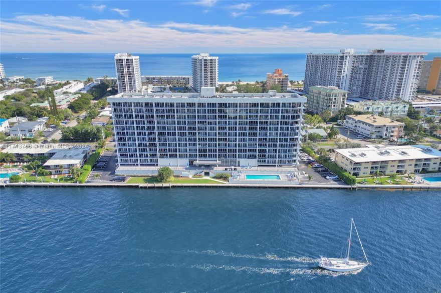 Fall in love with this beautifully renovated condo, designed for coastal living.The versatile den has been transformed into a cozy second bedroom with a Murphy bed, perfect for hosting guests. Featuring hurricane-impact windows and elegant ceramic floors throughout, this unit exudes modern style. The living room and master bedroom both boast patio doors opening to breathtaking views. The open-concept kitchen is a centerpiece, complete with stainless steel appliances and stylish finishes.Just one block from the beach, this desirable community offers incredible amenities: a waterfront pool, BBQ area, gym, clubhouse, and garage parking. Situated in a prime location close to restaurants, shopping, and entertainment, this condo blends luxury, convenience, and charm. Don’t miss out!