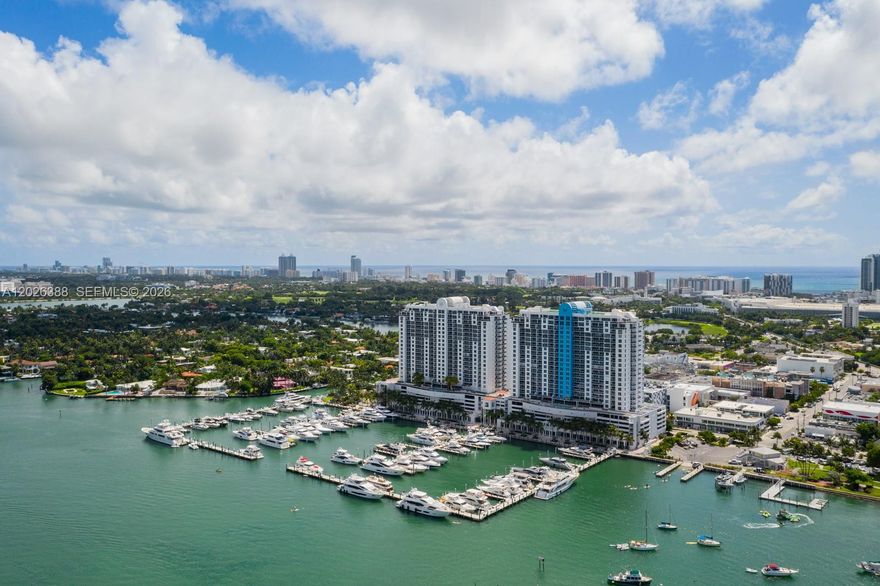 Experience refined coastal elegance in this masterfully reimagined 3BR/3BA sanctuary on the coveted west side above Sunset Harbour Yacht Club . Spanning 1,900+ square feet, this residence is a masterclass in contemporary design, where walls of glass frame unobstructed views of the shimmering bay, the marina, and the iconic Miami skyline.

The seamless layout flows onto three private terraces—accessible from every room—inviting the golden hour glow inside. At the heart of the home, a custom chef’s kitchen serves as a culinary showpiece, featuring induction technology, a social island, and dedicated wine storage. Each bedroom is a private retreat with an en-suite bath, balcony, custom closets and the convenience of electric shades.

This condo is your entry into the exclusive Sunset Harbour lifestyle.  Residents enjoy luxury amenities including a bay-view fitness center, sauna, resort deck, 24/7 doorman, and specialized storage for bikes and paddleboards. The residence also includes two deeded parking spaces, valet and available EV charging.
From your doorstep, wander the bay walk to Maurice Gibb Park or indulge in the world-class dining and wellness boutiques that define Miami’s most walkable, sophisticated neighborhood. This is modern luxury, perfectly positioned.
The building is months away from completing a $12M transformation, further elevating its status and resident comfort.  Assessment paid in full by seller, and HOA has excellent finances and reserves