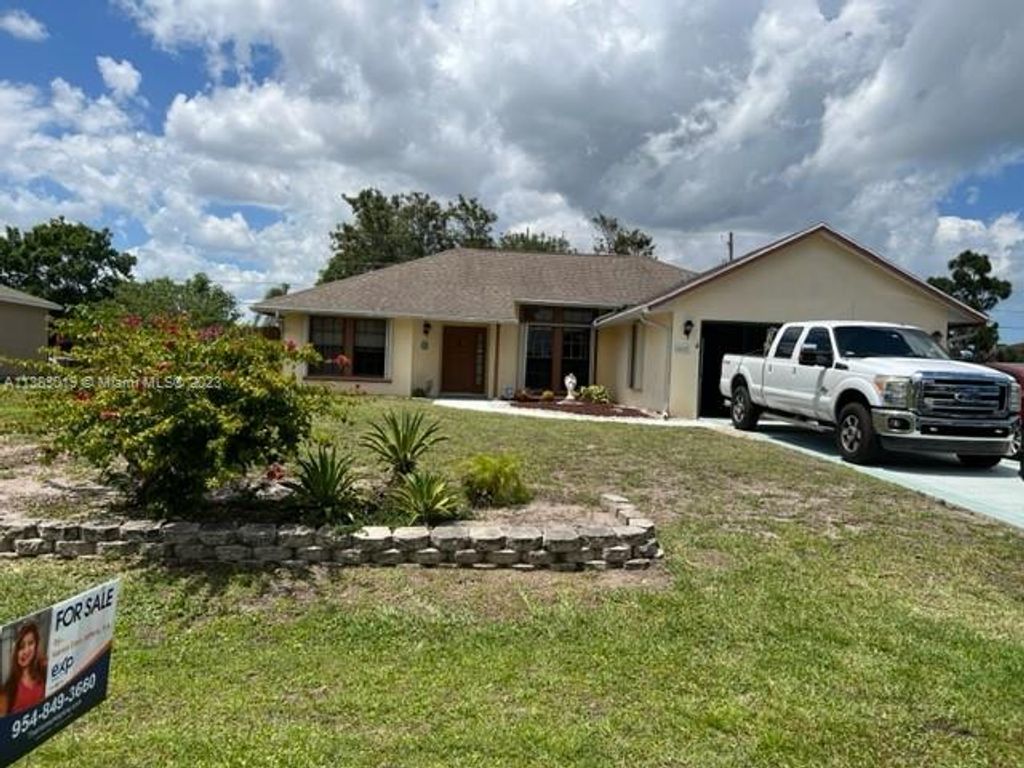 Photo of 425 SW Prater Ave, Port Saint Lucie, FL 34953 (MLS # A11383019)
