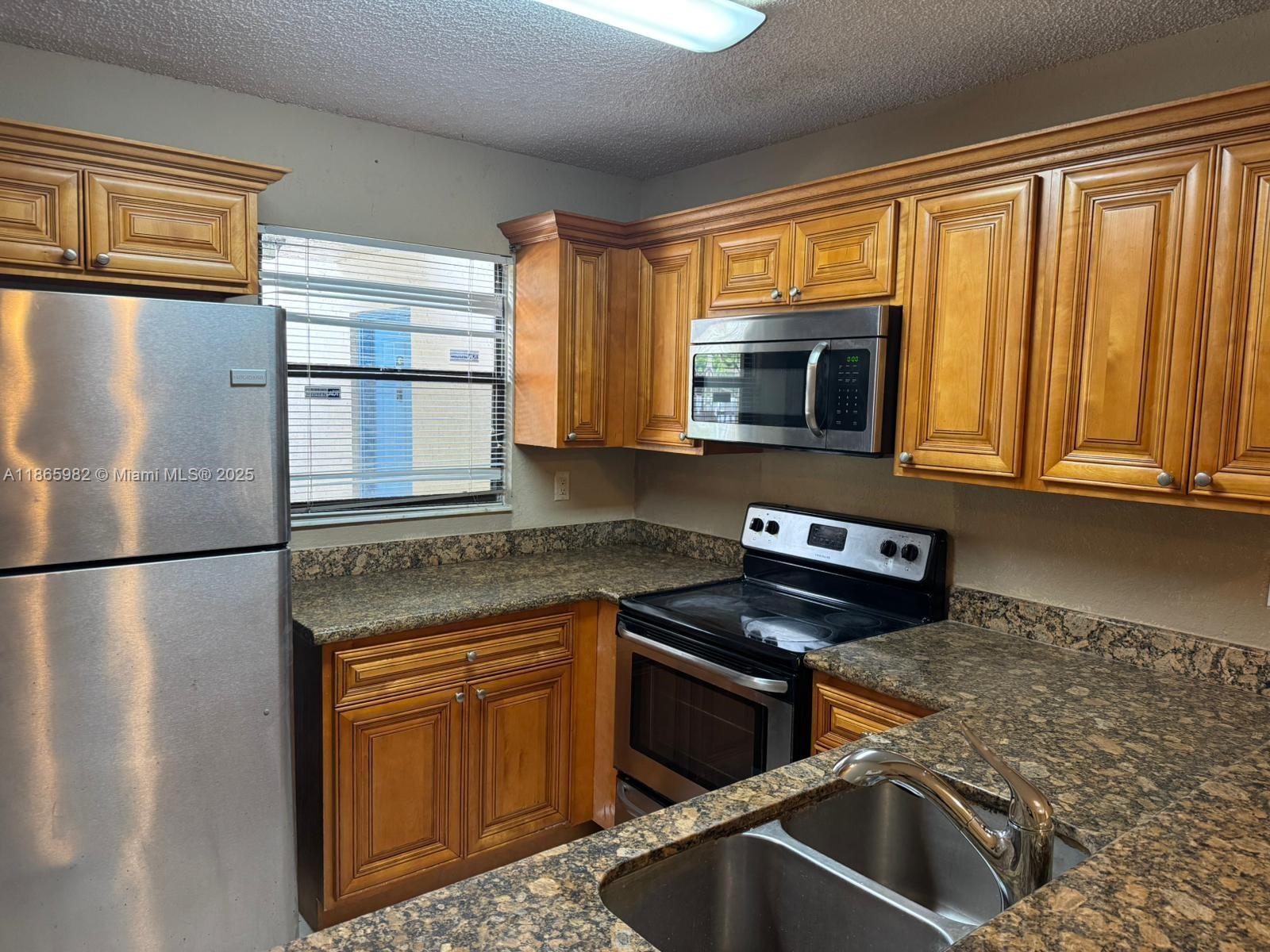 Beautiful garden view unit in a great community! New tiles floors in bedrooms, freshly painted, This apartment features 2 bedrooms, 2 baths on a practical layout. Parking. Gated community. Excellent location!