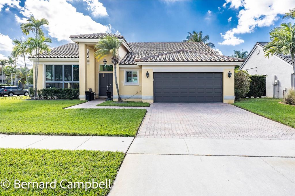 Photo of 1210 NW 193rd Ave, Pembroke Pines, FL 33029 (MLS # A11977098)