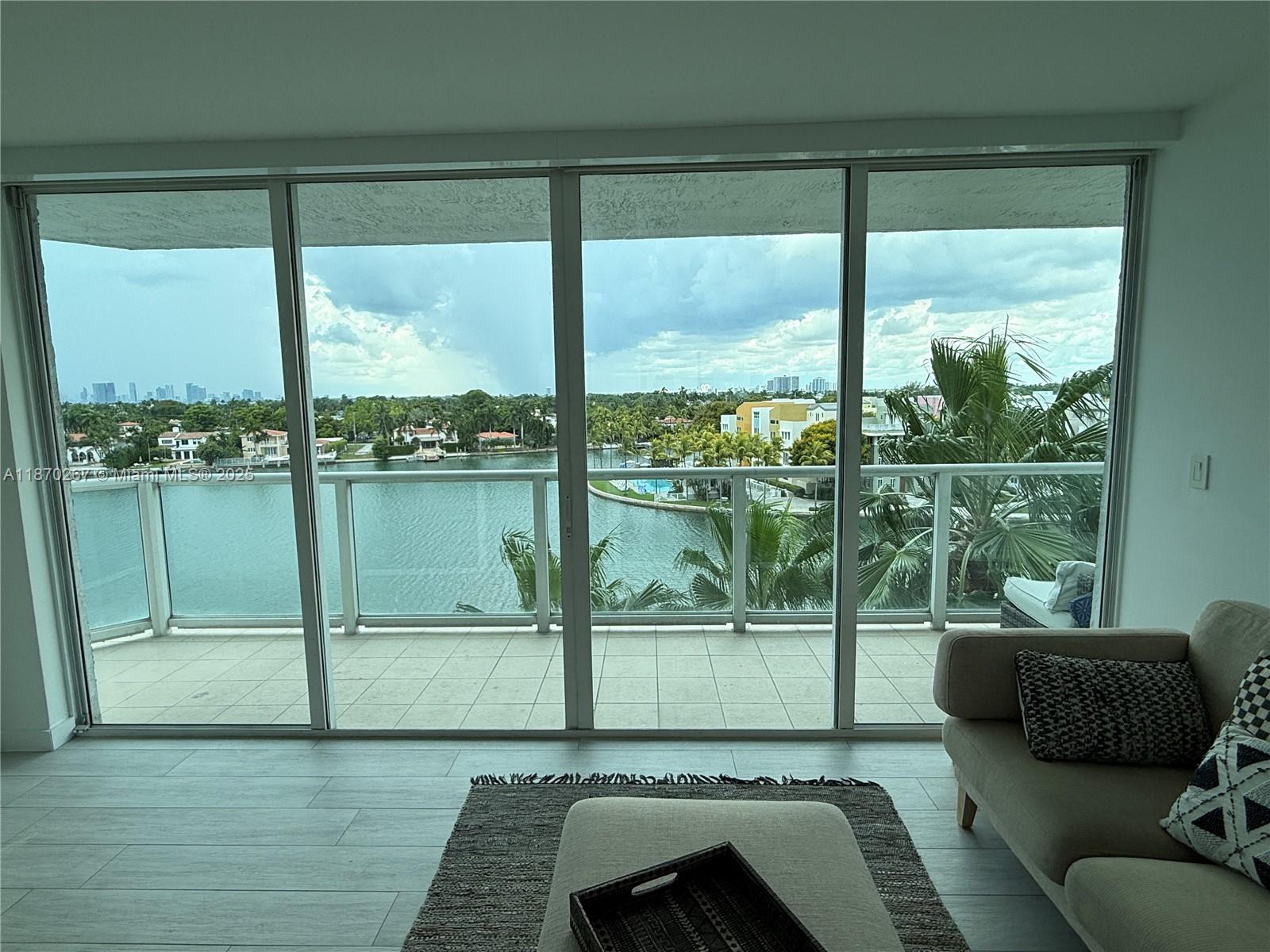 Enjoy stunning, sunset and water views from this bright, renovated and spacious two bedroom, two bath with plenty of closet space. Can be rented unfurnished or partially furnished. Kitchen with stainless steel appliances, completely outfitted if desired. W/D in unit. Building amenities include: heated pool, gym, sauna, Jacuzzi, 24-hour security, and valet parking. Assigned garage space. Landlord is offering MONTHLY RENT REBATE ($250/month) until pool renovation is complete. Intracoastal water / Miami skyline views from every room as well as a large balcony. Walk to beach, supermarket, restaurants and shopping. as well as easily accessible to South Beach. Blinds/blackout shades. Tile floors throughout.