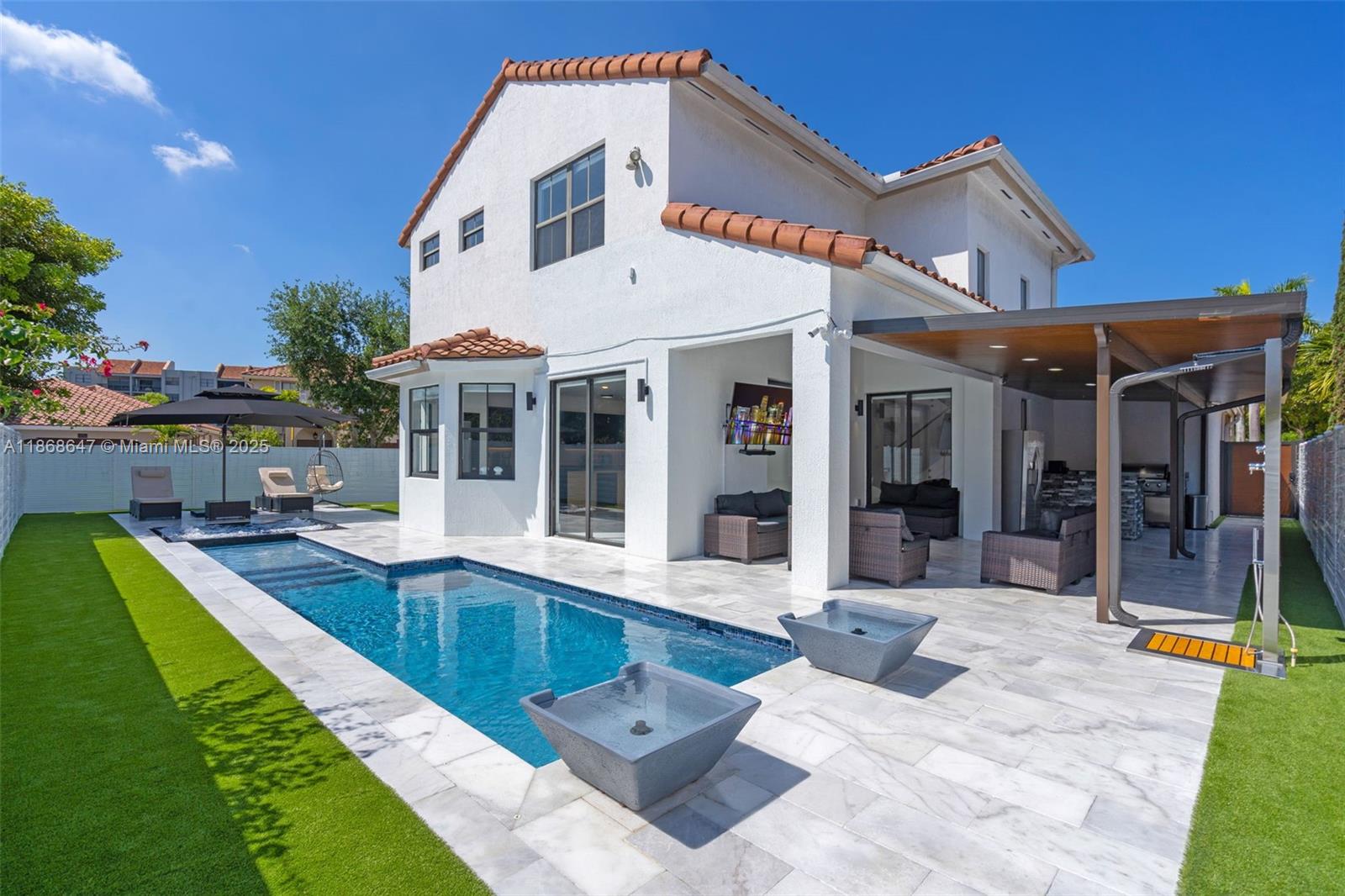 WELCOME HOME TO THIS INCREDIBLE PROPERTY OFFERING RESORT STYLE AMENITIES, 4 BEDROOMS, WITH 1 BEDROOM ON THE FIRST FLOOR, 3 BRAND NEW BATHROOMS, HIGH CEILINGS, IMPACT WINDOWS, SUMMER KITCHEN, 2 CAR GARAGE, AND AMPLE SPACES ALL AROUND. FROM THE MOMENT YOU WALK IN, YOU WILL NOTICE THE ATTENTION TO DETAIL IN EACH CORNER. WITH A STUNNING INFINITY POOL, JACUZZI AND SUMMER KITCHEN, THE POSSIBILITIES TO ENTERTAIN ARE ENDLESS. CLOSE TO ALL MAJOR HIGHWAYS, CONVENIENT SHOPPING CENTERS AND A+ SCHOOLS. IF YOUR LOOKING FOR A FOREVER HOME OR PERFECT INVESTMENT, THIS PROPERTY IS FOR YOU.