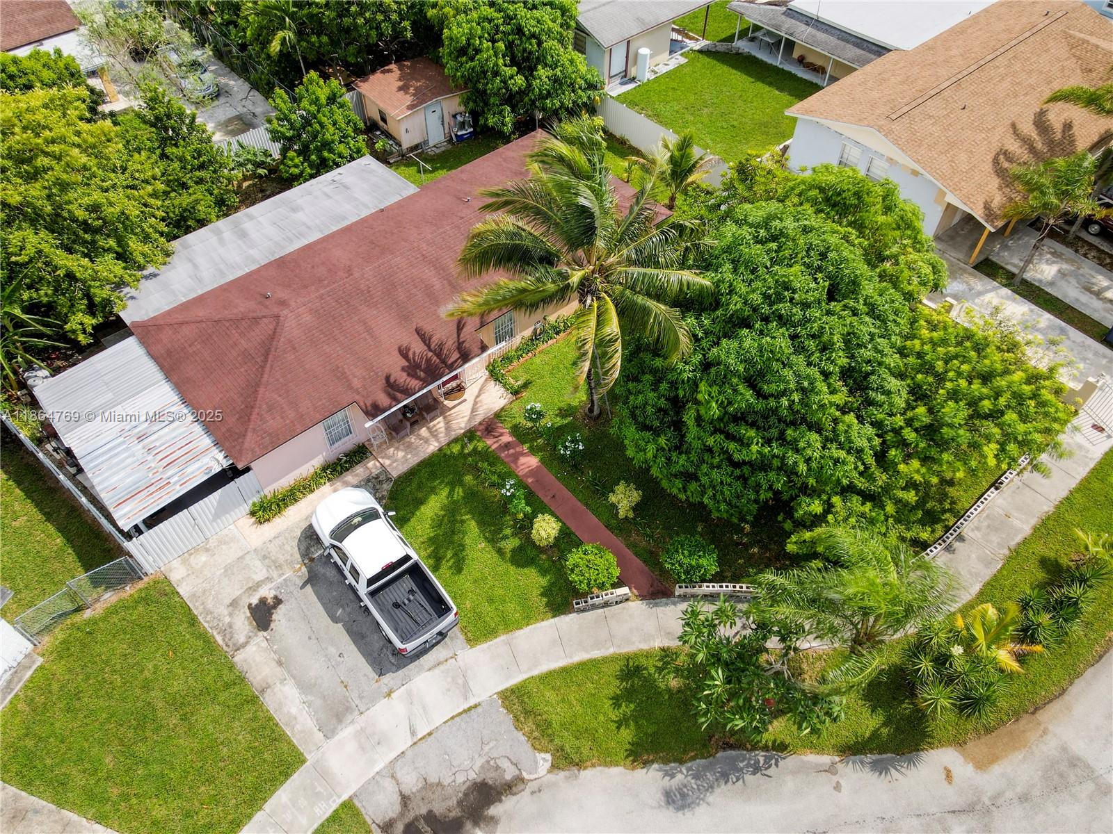 Spacious 4-bedroom, 2-bath single-family home with no HOA, located on a quiet cul-de-sac. New roof installed just 7 years ago (2018), new A/C from 2019, and a new water heater provide peace of mind for years to come. Each bedroom offers a walk-in closet which is rare. The updated kitchen features stainless steel appliances and a washer/dryer in a dedicated laundry room. The large family room provides plenty of space for gatherings, and dual central A/C units allow for comfort and efficiency. Enjoy a fenced backyard with mature fruit trees including mango plantain and more. Also includes a storage shed and covered deck with space for a vehicle in your yard. Drive way fits multiple cars. Near schools, shopping, restaurants, and just one minute drive to the Turnpike for easy commuting.