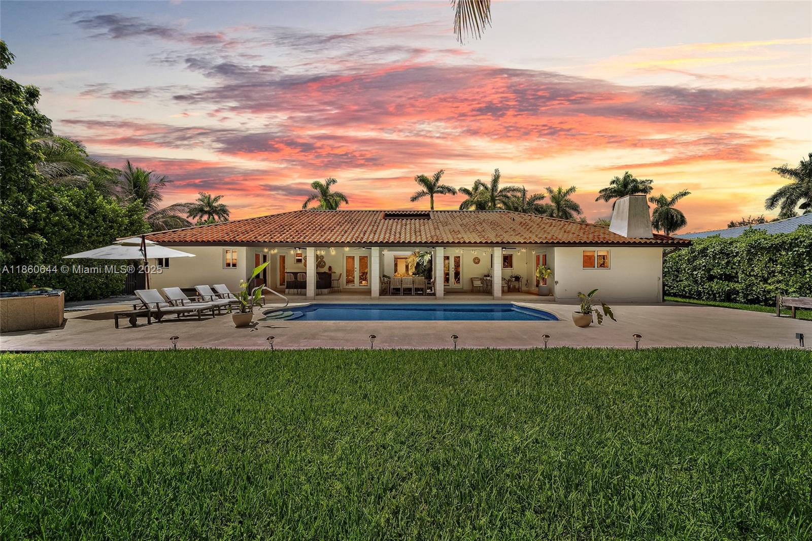 Modern Elegance meets Spacious Comfort for seamless indoor-outdoor entertaining in Kendall’s most desirable neighborhood. Updated 4-bed 2.5-bath Boho chic home offers 2,550+ SF of all white porcelain tiled open living space on a massive 17,000+ SF fenced corner lot. Soaring vaulted wood ceilings, expansive impact French doors & picture windows flood this home w/natural light. Remodeled chef’s kitchen boasts custom wood cabinetry, pull-out shelves, double wall oven & counter seating that flows into a large family room w/fireplace. Step outside to a private backyard oasis w/pool, fruit trees, covered patio w/fans & full outdoor bar w/sink & fridge. Custom CA closets, gated covered boat parking, circular driveway & 2-car garage...just mins from top schools, Baptist Hospital, Turnpike & 874!