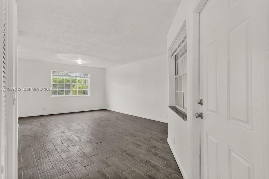 Spacious and well-maintained 2-bedroom, 2-bath corner unit located at 8621 SW 5th St #201 in Pembroke Pines. This bright second-floor residence offers an open layout with abundant natural light, tile flooring throughout, and a private screened balcony ideal for relaxing. Functional kitchen with ample cabinet space and generously sized bedrooms with great closet storage. Conveniently located near major highways, shopping, dining, parks, and everyday essentials. Easy to show and ready for immediate occupancy.