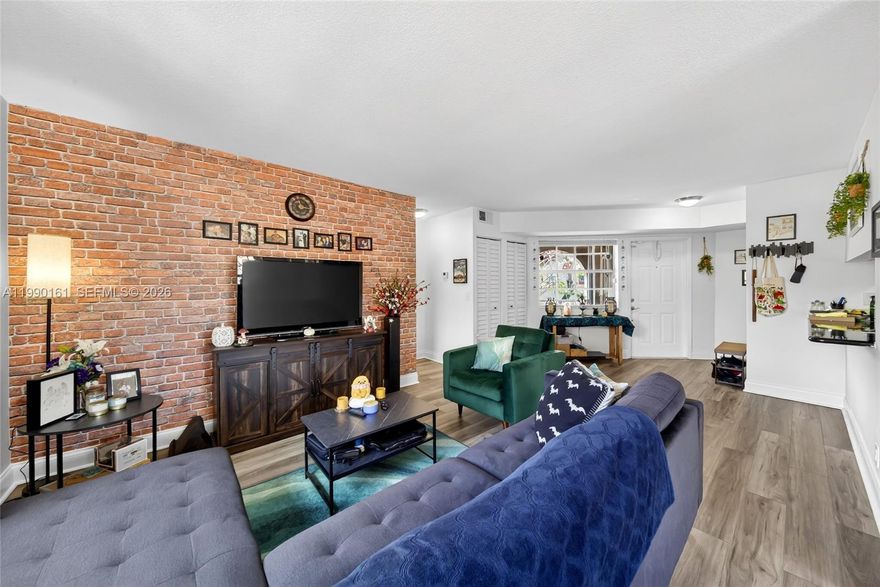 Welcome to this bright, spacious & well-maintained 1 bedroom condo with 2 full baths located in the heart of Pembroke Pines! Notable improvements done in 2022: New AC, LVP flooring throughout, baseboards, popcorn ceiling professionally removed, new tankless water heater, interior paint, blinds & accordion shutters. Kitchen has granite counters & SS appliances. Convenient in-unit laundry. Both bathrooms have been updated as well. The building's roof was also replaced in 2022. One assigned parking space in front of building plus an option for a 2nd resident vehicle. Complex has a brand new virtual security guard gate system & more future community improvements are being planned.