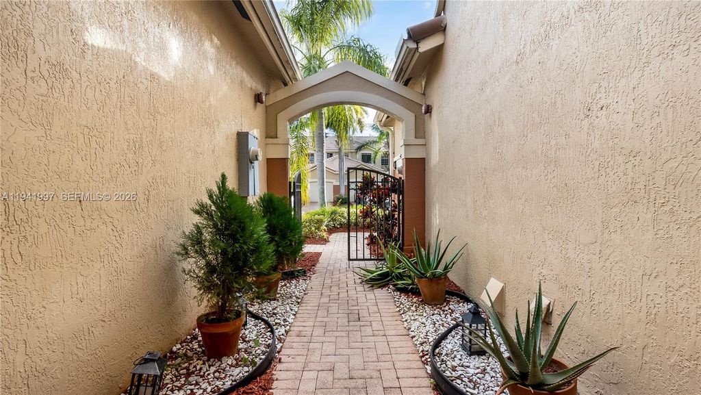 Photo of 3889 Tree Top Dr #3889, Weston, FL 33332 (MLS # A11941997)