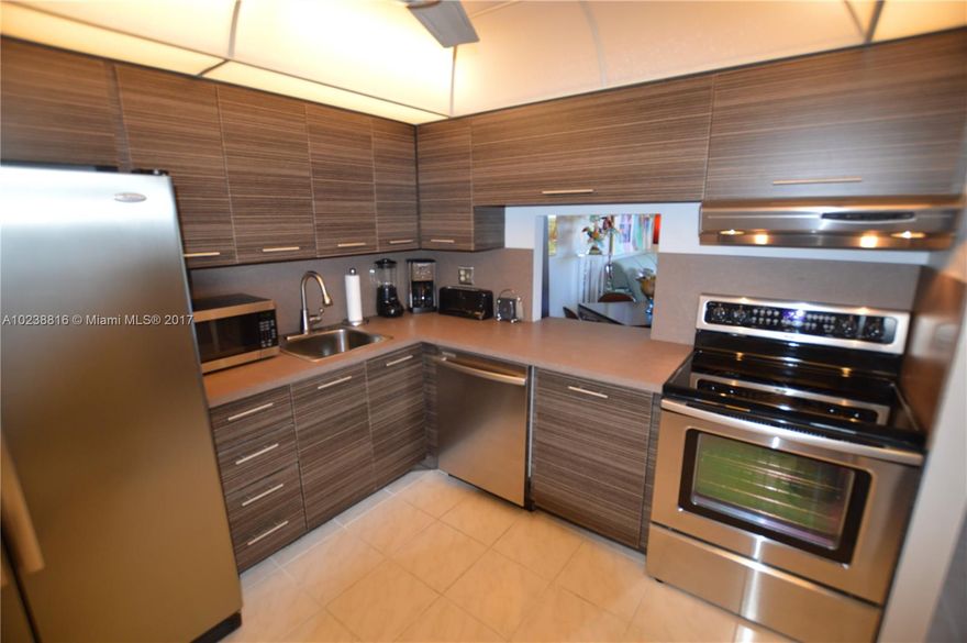 BEST VALUE!!  Beautiful, Upgraded Condo Home with SWEEPING EAST VIEWS of Fort Lauderdale Coastal Skyline and Middle River! Close to WILTON DRIVE/Restaurants/Entertainment! Enjoy cooking in the  DESIGNER Kitchen / STAINLESS STEEL APPLIANCES! Brazilian Cherry Wood Laminate Floors. Hurricane IMPACT SLIDERS/WINDOWS, HEATED POOL, Private GATED PARKING, SECURED Building! FREE ATT 300 Cable! FREE LAUNDRY included in HOA fees! DRAKE TOWER the ONLY HIGH RISE CONDO in the WILTON MANORS AREA!