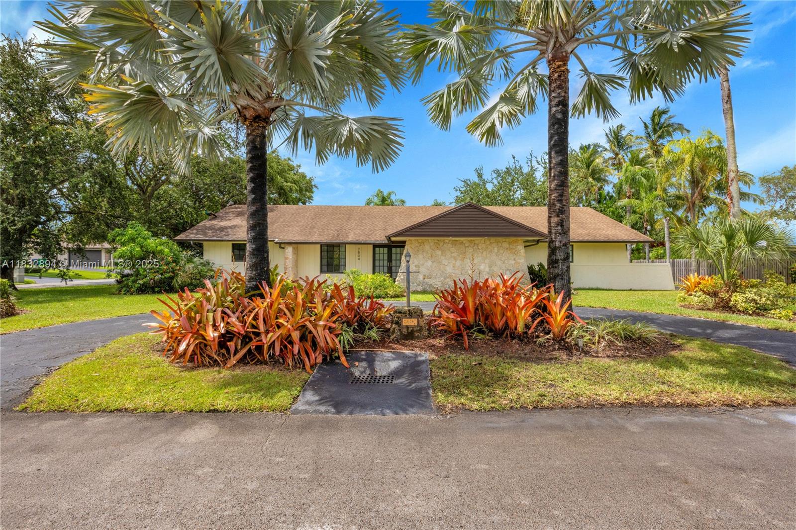 Beautiful 4-bedroom, 2-bathroom Jennings-built home located in Palmetto Bay’s sought-after Cutler Hammock community. Nestled on a lushly landscaped corner lot across from a natural preserve, this home sits on a quiet cul-de-sac offering privacy and tranquility. Features include a spacious kitchen with pass-through to the dome-screened pool and patio, custom closets with pull-outs, full-house generator, freshly painted interior, impact windows and doors, and a newer roof. Ideal for entertaining or relaxing outdoors under the large covered patio. Located in preferred Flood Zone X with no HOA. Close distance to Palmer Trinity and Bill Sadowski Park. A true Palmetto Bay gem! Some photos have been virtually staged.