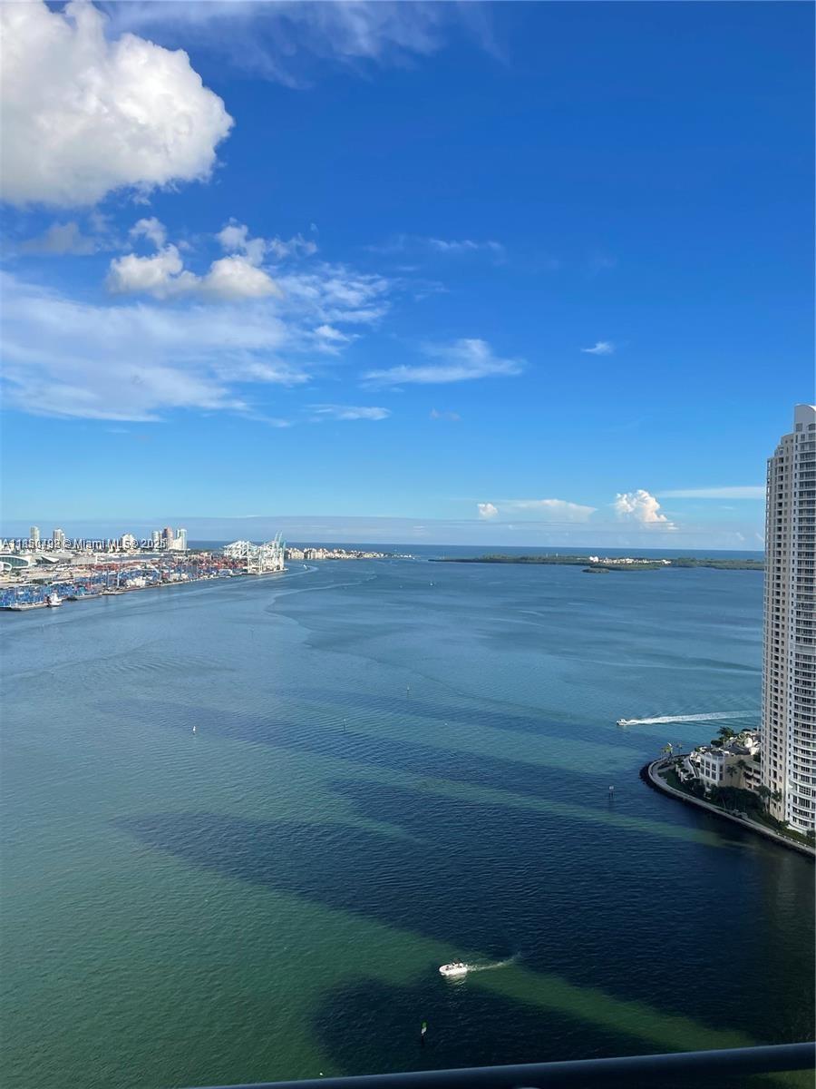 Spacious 3/2 with views from every room. Unit has marble floors throughout, upgrade with glass shower door in master bath, kitchen with wood cabinetry and granite countertops, direct bay and southeast exposure to Brickell key and Key Biscayne, also views north to Downtown Miami skyline. Full service building with fitness center, pool, mini market, two restaurants on site. At your footsteps is Bayside market, FTX arena, metro mover, short distance to Brickell City Center, Whole Foods, shops, entertainment and so much more.