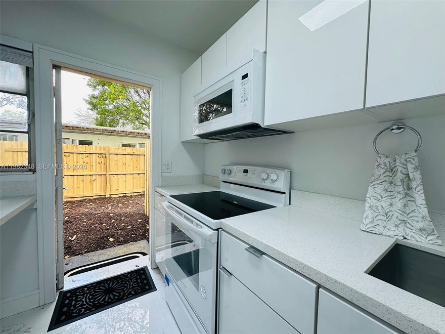 Stunning apartment JUST LISTED, renovated and boasting abundant natural light, nestled in one of Fort Lauderdale's most coveted neighborhoods, just steps away from major thoroughfares: a mere 50 meters from A1, 8 minutes from I-595, and downtown Las Olas, with the beach a mere 10 minutes away. This exceptional unit is part of an enclave of only 8 residences, where internal guidelines foster a harmonious and tranquil living environment for all residents. Impeccably remodeled. Brand new bathrooms, kitchen, and appliances. Community amenities include a fully-equipped laundry facility with washers and dryers that are included in the rental price. Private backyard!