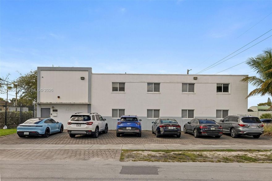 The Mendel Fellig Group is pleased to offer for sale 17890 NW 29th Court in Miami Gardens. This property presents a unique opportunity to acquire a commercial warehouse facility discreetly located within a quiet residential neighborhood, while remaining in close proximity to the main artery of Miami Gardens Drive. The property benefits from excellent accessibility, with convenient access to the Florida Turnpike, I 95, the Palmetto Expressway, and the Golden Glades Interchange. The building completed its 40 Year Certification in 2017 and has been substantially updated. The facility is equipped with heavy power, featuring a three phase 600 amp electrical system. Construction consists of a concrete slab foundation and durable concrete block structure, with impact windows installed throughout and zoned air conditioning. The warehouse offers three roll up overhead doors with 14 foot clearance and 16 foot clear ceiling heights. The property includes 6 bathrooms in total, with two serving the warehouse floor.
Office improvements include 3 high end private offices, a conference area, and an open bullpen workspace. The upstairs office is built out with a full luxury bathroom including a shower. The office located on the warehouse level has been professionally soundproofed. A break room with a full kitchen is also provided.
Exterior features include ample parking, a secured yard, exterior lighting, and additional secured outdoor storage.