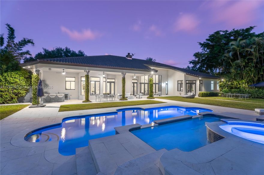 Located on a palm-lined road in sought-after N. Pinecrest, this one-story gated residence offers a designed layout with soaring ceilings & well distributed living spaces. The dine-in chef’s kitchen opens seamlessly to a spacious family room and comes with a glass wine cellar The elegant primary suite includes a large sitting area. Upgrades: impact windows/doors, whole-house generator, New Roof (2023), new garage doors, modern lighting, custom closets, exterior cameras, updated A/Cs, and new appliances. The expansive, landscaped backyard is a true South Florida retreat—featuring a resort-style pool, summer kitchen, koi pond, shaded dining areas, and mature trees for ultimate privacy.  Located in the top-rated Pinecrest Elementary School district with quick access to shops, dining, and US-1.