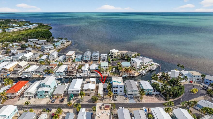 Canal front opportunity with direct ocean access! Located in a highly desirable waterfront neighborhood near Harry Harris Park, this 2-bedroom 2 bath mobile home offers unbeatable location and boating access. Enjoy close proximity to the beach, boat ramp and all the conveniences of Tavernier Town Center, including shopping, restaurants, a movie theater and more. Situated on deep water with direct ocean access, the property features a concrete seawall with davits, making it a true boater’s and fishing haven. Outdoor sink provides the perfect fish cleaning area, plus two utility/storage rooms under the deck for added functionality. The home includes parquet flooring, washer and dryer hook up and microwave, refrigerator, oven and gas range. While the property is fully functional, it presents an excellent opportunity for renovation, updating or potential re-development to maximize its prime canal-front location. Whether you’re looking for a keys getaway, investment opportunity, or the perfect spot to create your own waterfront retreat, this property offers exceptional potential in an unbeatable setting.