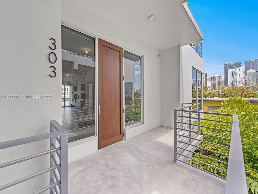 Exquisite 4-bed, 4.5-bath corner unit at Eleven in The Roads, a 2020 boutique building by Kobi Karp. Steps from Brickell, downtown Miami, and Key Biscayne, with Coconut Grove and Coral Gables nearby. Unit 303 features 9.6-ft ceilings, floor-to-ceiling windows, and an open layout. Enjoy a private turfed rooftop terrace with gas grill, summer kitchen, and stunning Brickell and Downtown views. The Italkraft kitchen has Bosch appliances, wine cooler, and chef’s island. Includes washer/dryer, 4 parking spaces, storage, meticulously designed closets, smart lighting, and automatic shades. Amenities: rooftop pool, lounge, BBQ. Ideal for tranquil urban living.