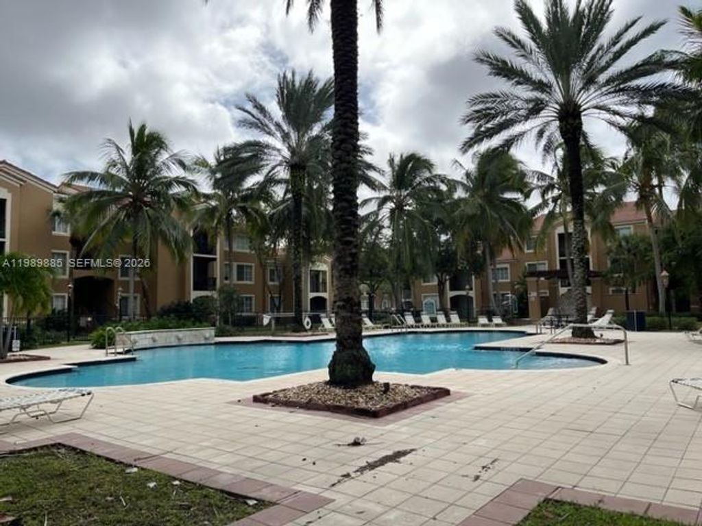 Photo of 8000 N Nob Hill Rd #206, Tamarac, FL 33321 (MLS # A11989885)