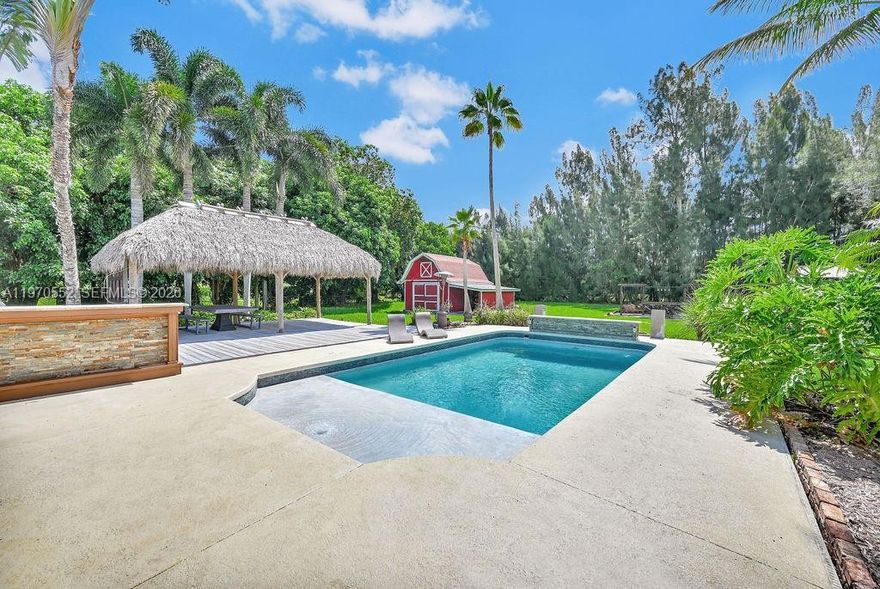 A rare opportunity to own a private 1.5-acre lifestyle estate in the heart of Southwest Ranches. This 4-bedroom, 3-bath home is all about outdoor living, privacy, and space—something increasingly hard to find in today’s market.

The backyard is designed to impress, featuring a pool, custom tiki bar, fire pit, and multiple entertaining areas that create a true resort-style experience at home. Whether hosting or relaxing, this property delivers a level of lifestyle that sets it apart from typical listings in this price range.

With no HOA and plenty of room for expansion, this is the perfect opportunity for end-users looking to enjoy now and customize over time.

If you’ve been waiting for land, privacy, and lifestyle in one property—this is it.