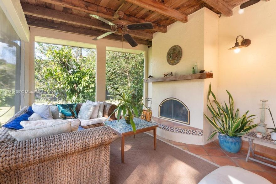 Looking for a quiet oasis in the country to call home? You will find plenty of land here for all your homesteading dreams, and some more!This unique home settled on 2.4 acres has 3 bedrooms, 2 baths, a gorgeous living room with a double-sided fireplace that you can also enjoy in the sunny, screened front porch, a roomy kitchen with glass door cabinets, and a pass-thru window overlooking the porch and front garden, and a back porch. A separate outbuild with electricity and water for workshop and storage; water pump system and electricity and water line for potential nursery area, and fence installed in 2022.Existing agricultural exemption for many fruit producing species, surrounded by gardens, a koi pond and beautiful mature trees. Potential for development in one acre in back of property.