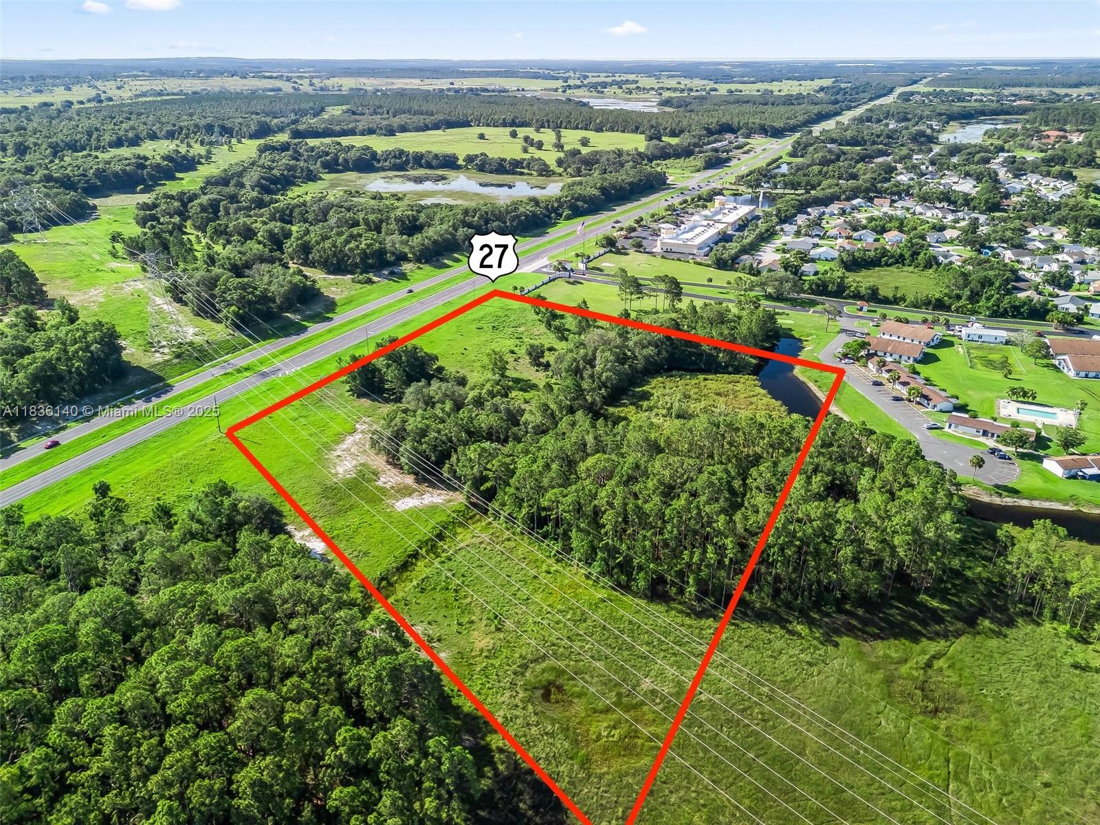 Discover 5.75 Acres of Prime Developable Land on US Highway 27 – Leesburg, FL. Preliminary approval for 130,200 Ministorage Facility. Preliminarily approved for 571 storage units. Contractor available for build out at $10,500,000. Opportunity awaits on this expansive 5.75-acre parcel of undeveloped land, ideally located along the bustling US Highway 27 corridor in Leesburg, Florida. Zoned for development, this property offers excellent visibility and accessibility with approximately 400 feet of highway frontage, making it a strategic choice for commercial, residential, or mixed-use projects (subject to zoning and permitting).