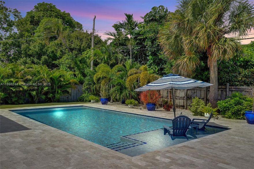 This immaculate 3 bedroom/2 bath pool home blends comfort, style & functionality. Enjoy peace of mind with all impact-rated windows & doors offering storm protection, sound reduction &  energy efficiency. The 2022 pool features dual sitting shelves, a heater & a chiller—perfect for year-round enjoyment. Newer tile roof, 2022 A/C &  a bright kitchen with granite counters, white cabinetry & new appliances. Both bathrooms are tastefully remodeled, & the versatile 3rd bedroom works perfectly as an office or den. A private laundry room adds extra storage, while the fenced, lushly landscaped backyard creates a serene retreat ideal for entertaining. The covered carport is great & there is more storage on the exterior side of the home. Close to top eateries and entertainment. This one has it all!