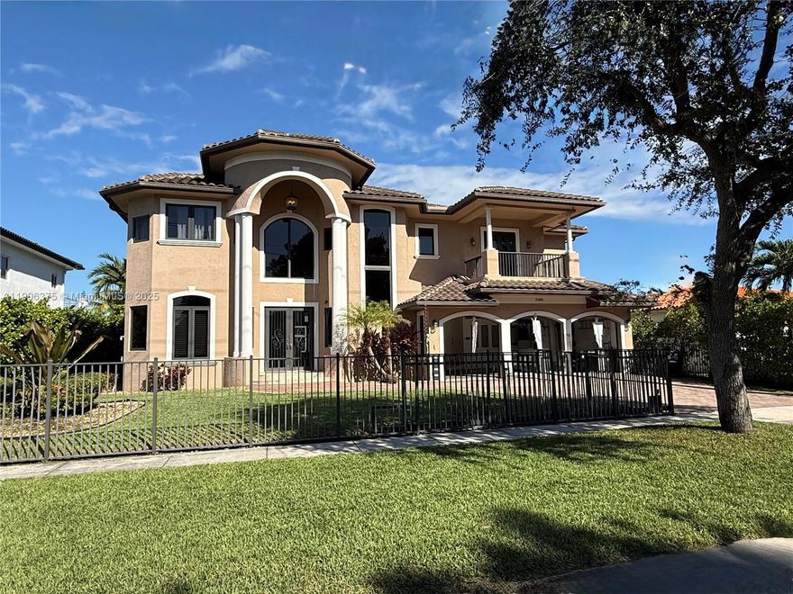 Beautiful two-story waterfront home built in 2017, located in the prestigious guard-gated Keystone Islands of North Miami. This 5-bedroom, 6.5-bath residence offers modern luxury with marble floors throughout, soaring ceilings, impact windows, and a private elevator. Each bedroom is an en-suite, providing comfort and privacy. The spacious primary suite features dual walk-in closets and a spa-like bathroom. Enjoy a true entertainer’s paradise with a covered patio, outdoor kitchen, and heated pool surrounded by lush landscaping. A private oasis with an over 80' dock on the Intracoastal, just minutes to the ocean. Park your yacht in your own backyard and experience the best of waterfront living.