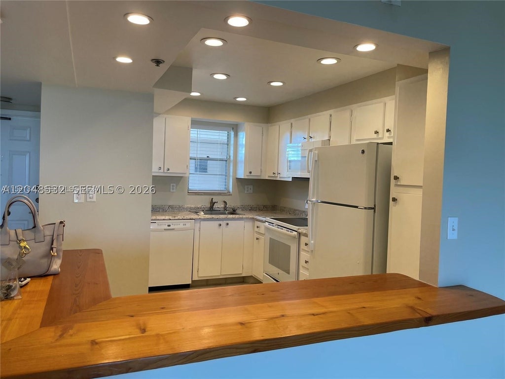 Photo of 3100 W Rolling Hills Cir #502, Davie, FL 33328 (MLS # A12048532)