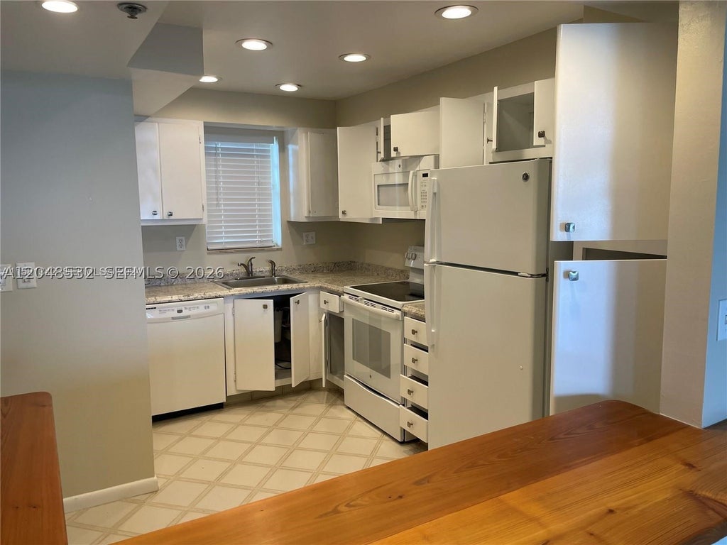 Photo of 3100 W Rolling Hills Cir #502, Davie, FL 33328 (MLS # A12048532)