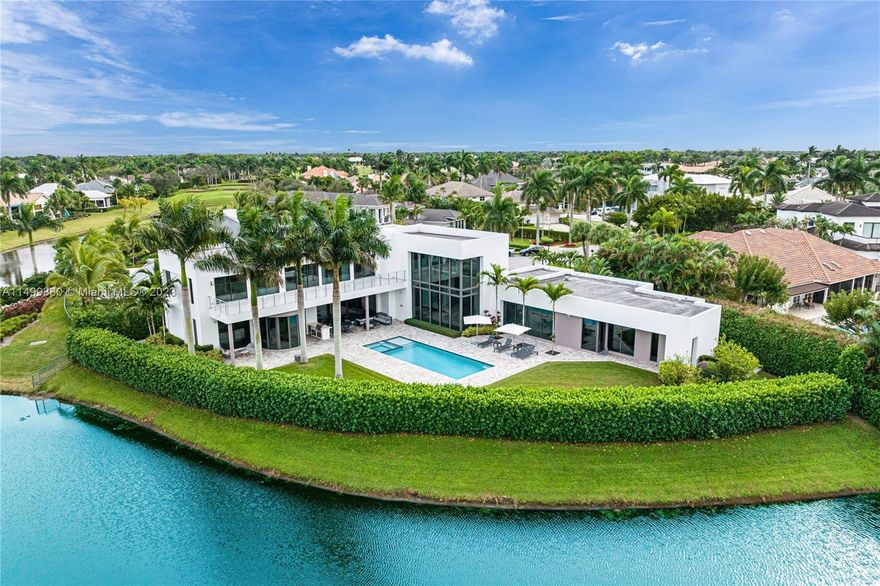 Located on a cul-de-sac, over looking a PAR 5 & tucked in St. Andrew’s, one of Boca's most prestigious gated communities, this luxurious two story spacious residence has magnificent architecture, exquisite custom finishes, & unique privacy. The extra high ceilings coupled with the panoramic windows invites tons of natural light & permits you to enjoy the views of the golf course & the lush green landscaping. The living room integrates the indoor & outdoor areas which creates a unique ambiance for entertainment. The master suite is located on the first floor designed for comfort with utmost craftsmanship. 5 bedrooms, 7.5 bathrooms, plus a media room & an office, gourmet chef's kitchen includes state-of-the-art appliances, elevator, generator, control 4 system, & a resort style pool.