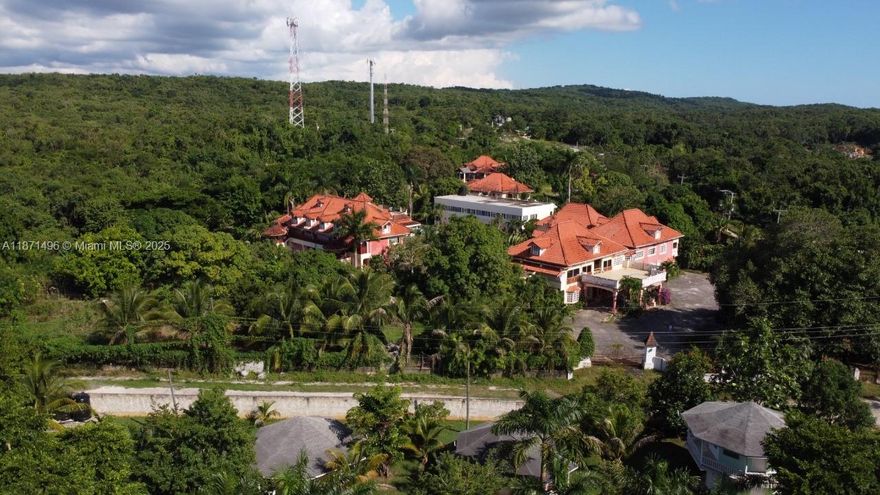 An incredible investment opportunity awaits on this expansive 10.5-acre property featuring a fully operational hotel, family main house, and vast unused lands for future development. With 46 completed guest rooms and 4 additional unfinished rooms, the estate spans 6 buildings including an admin block with 7 bedrooms, offices, meeting rooms, a function room with commercial kitchen, and ample storage. Guest accommodations include blocks with kitchenettes, spacious layouts, and a mix of single and multi-room options. A large dining gazebo with kitchen and restrooms complements the facilities, along with a swimming pool requiring pump installation. Ideal for a resort, retreat, or hospitality expansion, this property offers limitless potential and a solid foundation for significant returns.