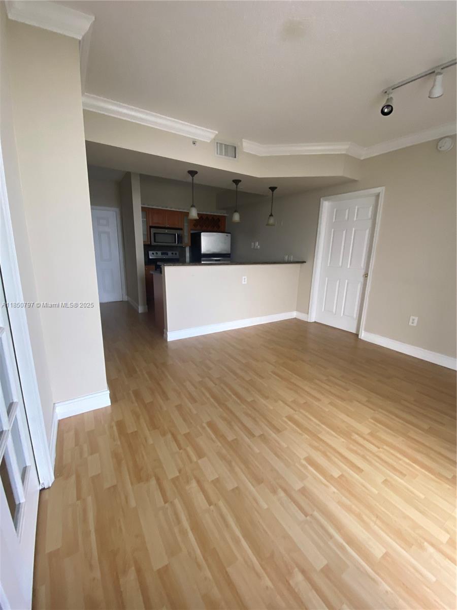 Modern 2 Bed/2 Bath in Altos de Miami! Split-bedroom layout with city view. Open kitchen with granite counters, in-unit washer/dryer, tile in one bedroom, and wood plank flooring throughout the rest. Secure building with 24/7 concierge, gym, and sun deck. One assigned garage space. Prime location near Downtown, Brickell, Coral Gables, Airport, Jackson Hospital & Publix.