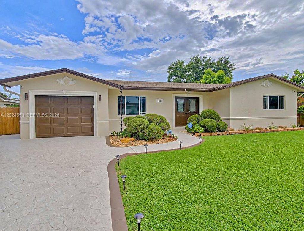 Photo of 1841 NW 113th Ave, Pembroke Pines, FL 33026 (MLS # A12024550)