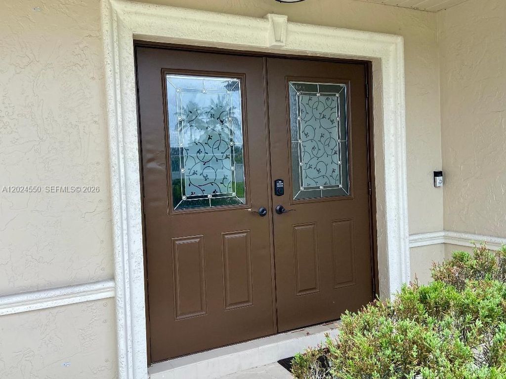 Photo of 1841 NW 113th Ave, Pembroke Pines, FL 33026 (MLS # A12024550)