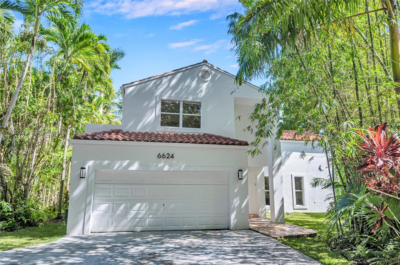 Welcome to this spacious home on a peaceful cul-de-sac in Davis Gardens, one of South Miami's most sought-after gated communities. This bright, airy home features double-height ceilings & lots of natural light. Enjoy a large kitchen w/ stainless steel appls & granite counters. Formal living & dining areas. Spacious family room that can be converted into a 4th bedroom. 1 bedroom w/ full bath downstairs. Upstairs you'll find an oversized primary suite w/ balcony & walk-in closets, a dedicated laundry/utility room & a 3rd bedroom with ensuite bath. 2-car garage. Enjoy a large backyard, plus community amenities including a pool, BBQ, tennis court & kids' playground. Situated in a fantastic central location, just minutes from South Miami's best restaurants, shops & top-rated schools.