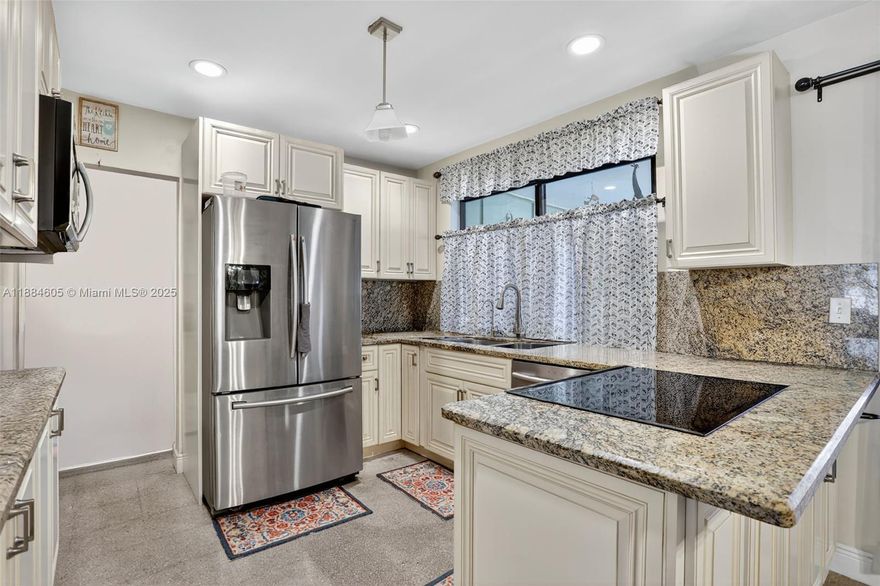 Discover the perfect blend of comfort and upgrades in this 2BR/2BA home with no HOA and rental flexibility. Recent improvements include impact glass, re-piped well sprinklers (2023), tankless water heater, 3-yr AC, and 8-yr shingle roof. Terrazzo floors grace the main living areas, with tile in baths and vinyl in bedrooms. The enclosed Florida room offers a versatile flex space for a 3rd bedroom, office, or playroom. A stylish granite and stainless steel kitchen with eat-in dining flows to a private backyard retreat featuring paver patio, gazebo, storage shed, and room for a pool & garden. Centrally located near shops and I-95/Turnpike.