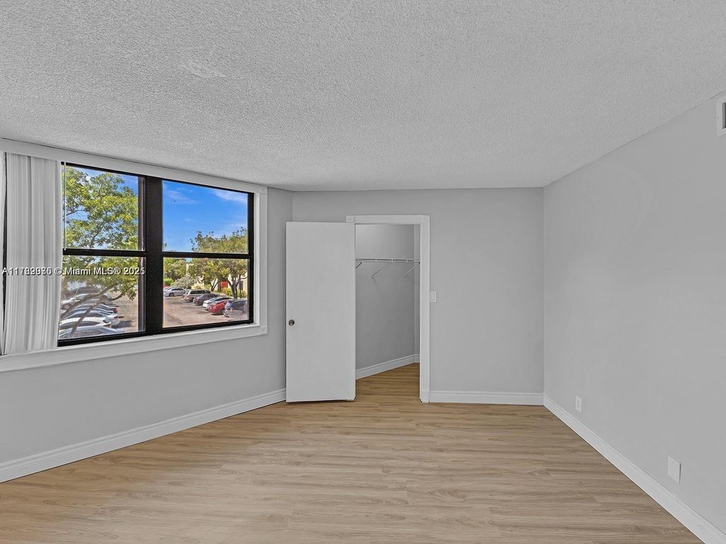 Photo of 215 Lake Pointe Dr #214, Oakland Park, FL 33309 (MLS # A11782075)