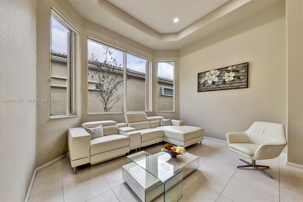 Photo of 12438 NW 57th Ct, Coral Springs, FL 33076 (MLS # A12007347)