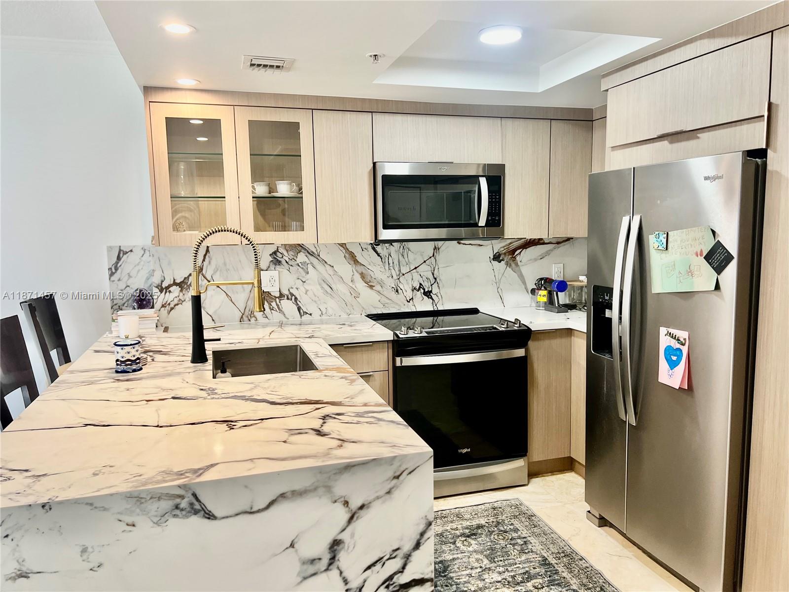 Completely remodeled, light, bright 1 bedroom 1 bath unit located on the 9th floor of The Mutiny in Coconut Grove, this unit features: Brand new modern kitchen , countertops, range, dishwasher, refrigerator. Full size washer and dryer inside your unit. Brand new bathroom featuring: New tile floors and shower walls, new custom cabinet, new counter tops, new shower glass door, new toilet. Custom walk in closet, custom cabinetry in the bedroom for extra storage. This unit faces east and has a balcony where you can enjoy the view of the marina in front as well as the key Biscayne bridge and skyline. Building has a beautiful tropical pool, gym and bar/restaurant. Valet parking, private parking in a garage. Walk to restaurants, bars, stores, Cocowalk! Bed and living room couch can be sold.