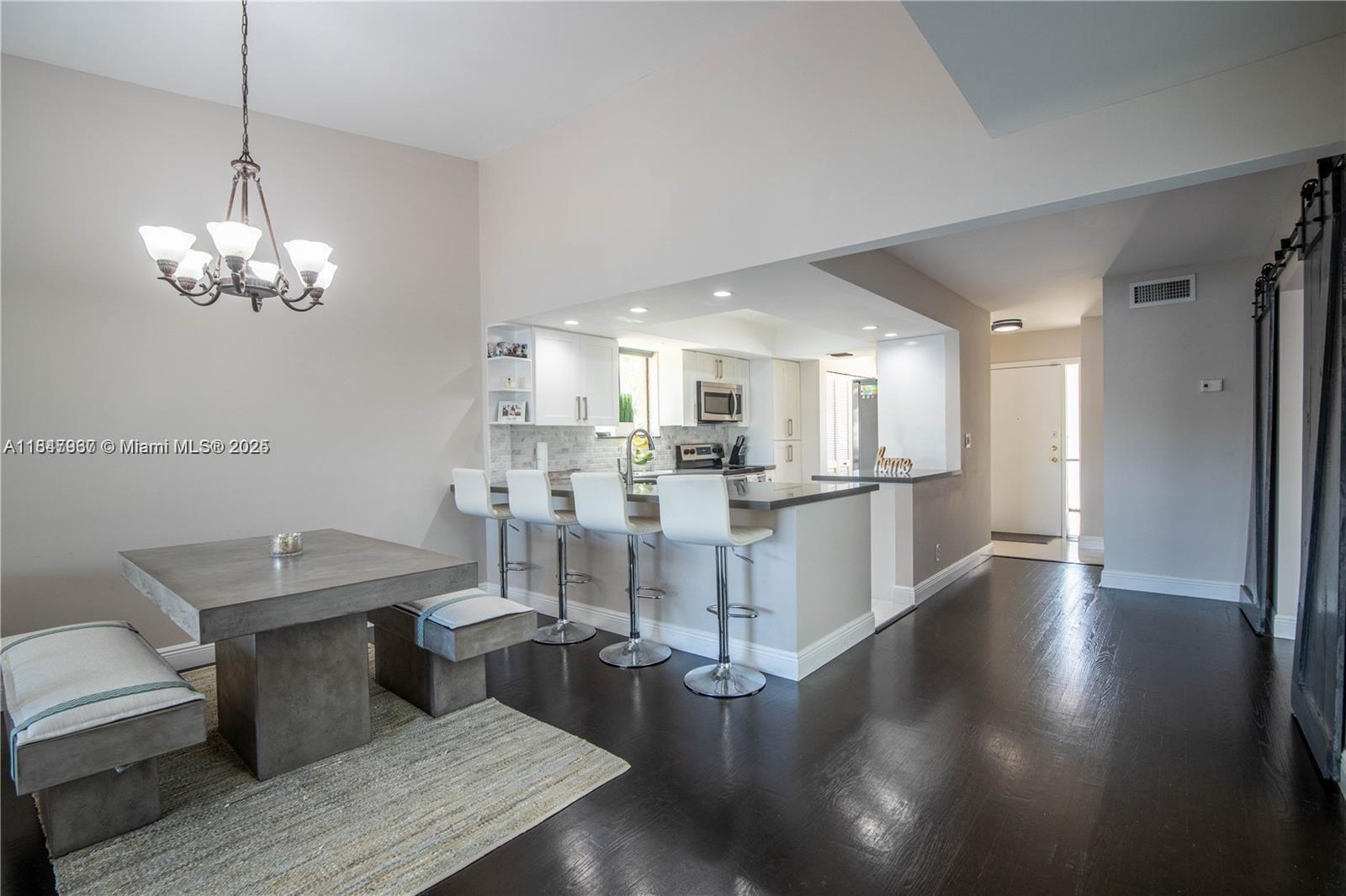 Fully renovated 3BED/2BATH open-concept villa with modern upgrades throughout. The kitchen features quartz countertops, wood cabinets with soft-close hardware, stainless steel appliances, and dimmable recessed lighting. Each bedroom opens to a terrace, with the master offering direct access to the backyard and serene lake views. Includes in-unit laundry, smart home features (Ring Doorbell, Ring Cameras, Nest Thermostat), and optional partial furnishings. Just steps from the community pool with 7 guest spots, 2 assigned spaces, and walking distance to Publix and Plantation Walk. Friendly reminder: pets are not permitted unless registered as emotional support animals.
