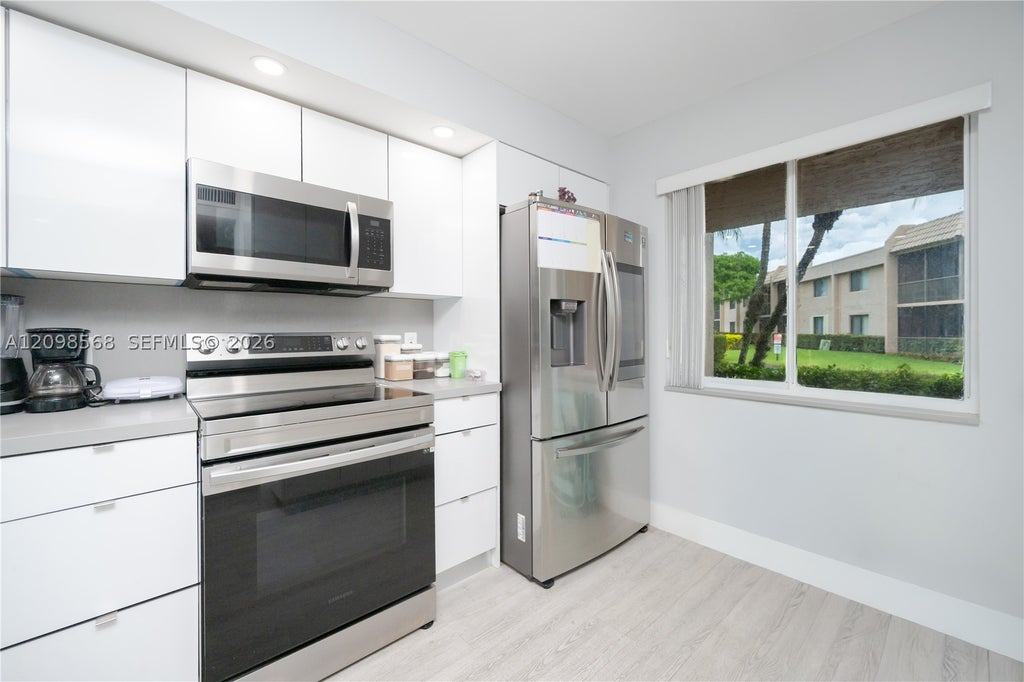 Photo of 350 Racquet Club Rd #102, Weston, FL 33326 (MLS # A12098568)