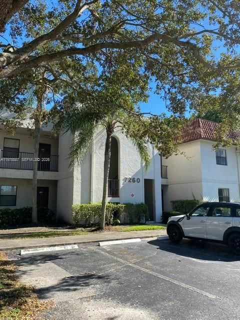 Photo of 7260 Woodmont Ter #101, Tamarac, FL 33321 (MLS # A11978587)