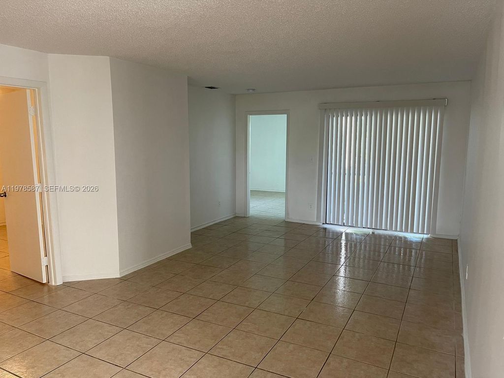 Photo of 7260 Woodmont Ter #101, Tamarac, FL 33321 (MLS # A11978587)
