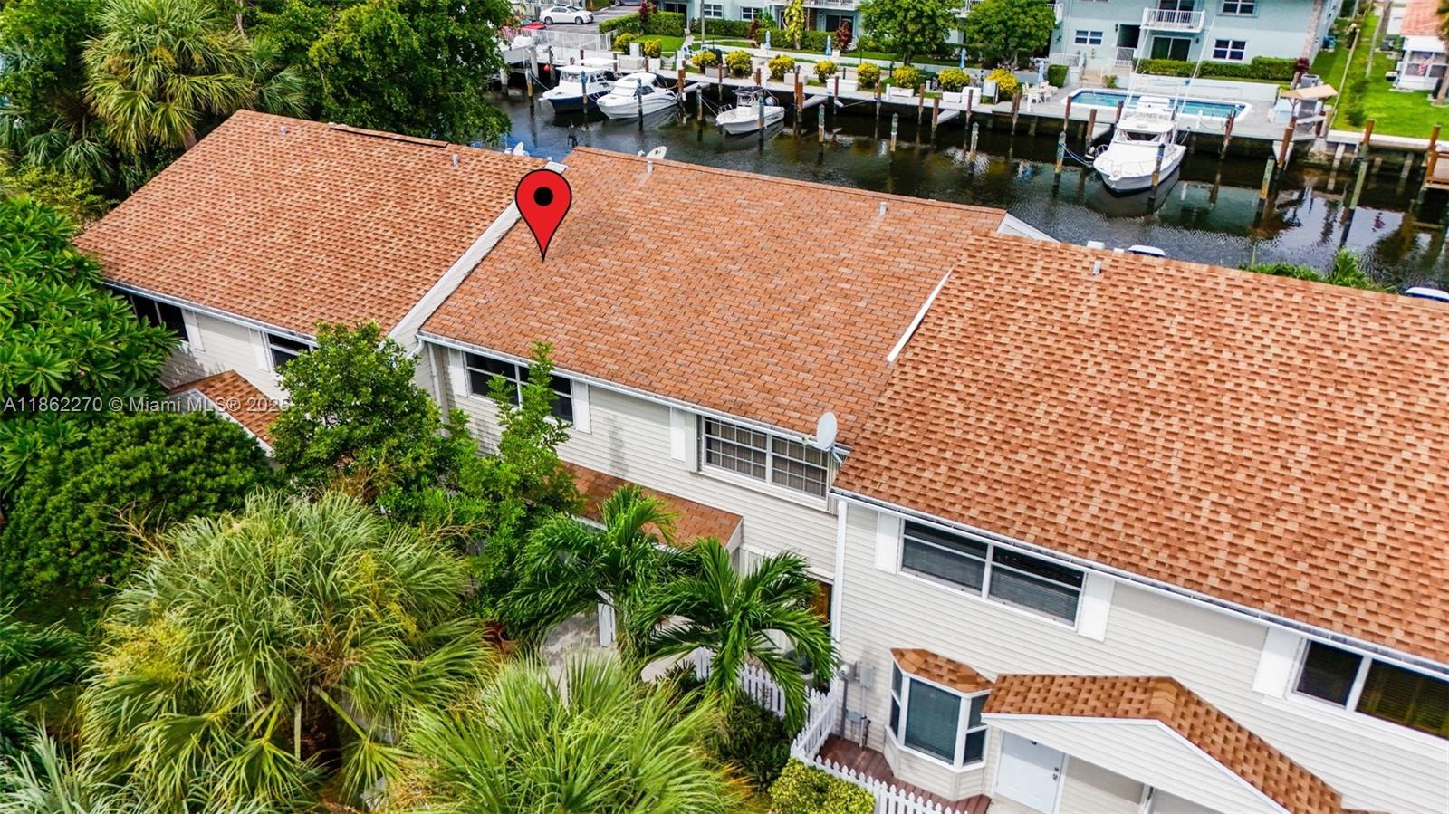 Enjoy tranquil canal views from this updated 2BR/2.5BA deep-waterfront townhome with direct Intracoastal access and no fixed bridges. Features include an open-concept layout, granite kitchen with Whirlpool appliances, new upstairs flooring and staircase (2024), newer air handler (2021), and tankless water heater (2016). Relax or entertain on your private patio just steps from the water. Dock ownership is separate, with priority given to community owners when slips become available, and rental options may be possible. Loggerhead Hidden Harbour Marina is right next door for additional storage. Fee simple ownership (not a condo) with low $210 HOA, FHA eligible. Roof replaced prior to current ownership. Leasing allowed immediately (min 4 months). Minutes from beaches, dining, and shopping.