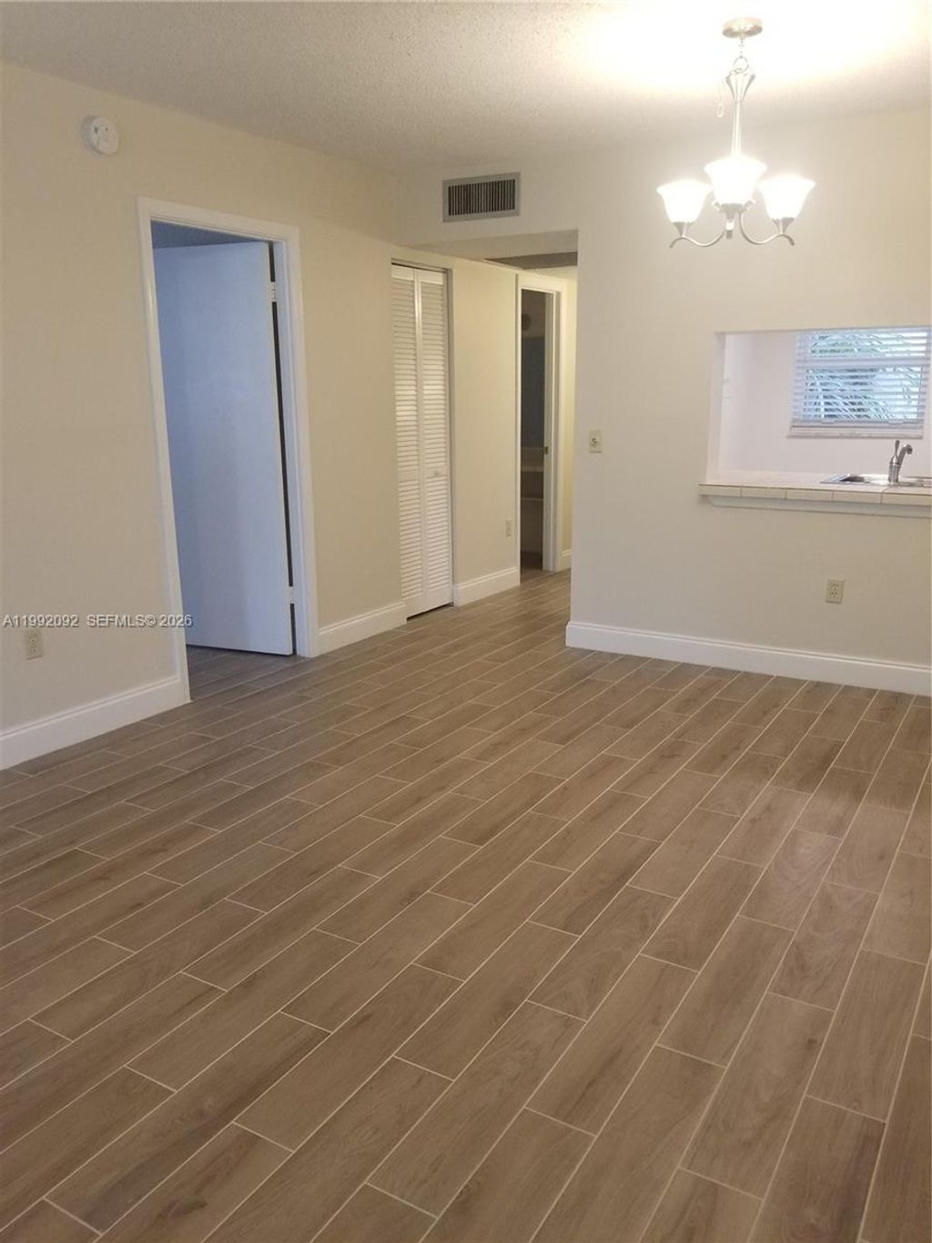 Photo of 9410 Poinciana Pl #101, Davie, FL 33324 (MLS # A11992092)