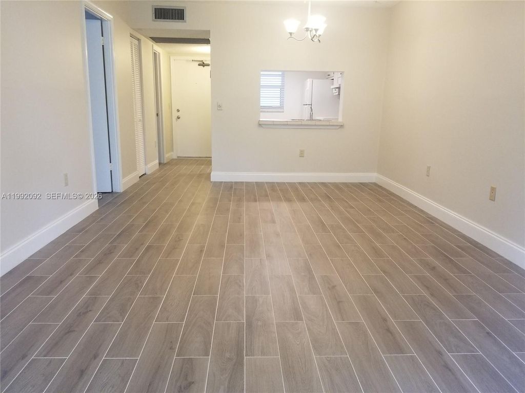 Photo of 9410 Poinciana Pl #101, Davie, FL 33324 (MLS # A11992092)