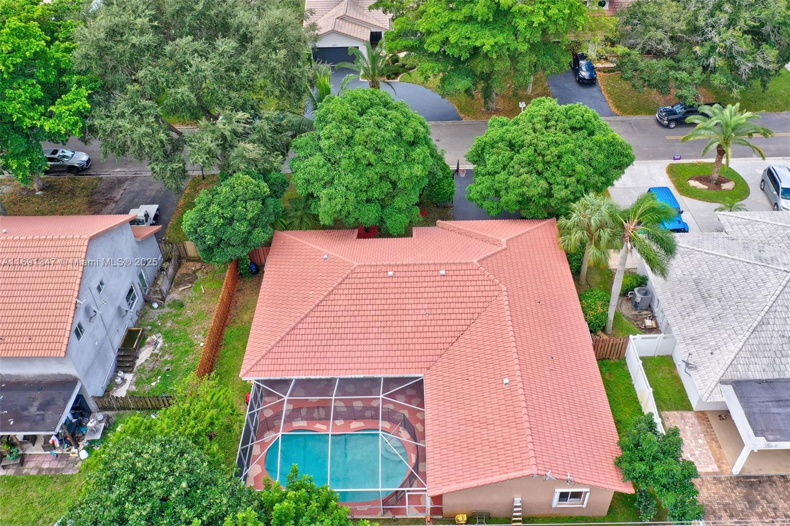 This beautifully 4 Bedroom, 2 Baths, 2 Car Garage Pool home offers a spacious, open layout with generously sized bedrooms and a thoughtful split floor plan, ensuring privacy and comfort for everyone. Features include stainless steel appliances, a cozy family room, a formal living room, a dedicated dining area, a convenient laundry room, and tile flooring throughout. The fully fenced backyard is ideal for both relaxing and entertaining, with a screened-in pool that provides a private oasis for year-round enjoyment. Perfect for families or anyone seeking a move-in-ready home with style, comfort, and functionality, this property is ideally located in one of Coral Springs' most sought-after neighborhoods.
