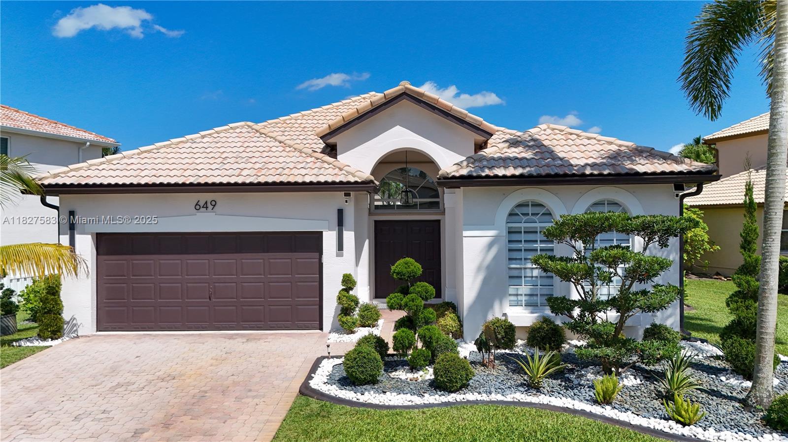 Step into this meticulously 3/2 remodeled Luxury home in the Gated desirable community of PEMBROKE SHORES. HIGH ceilings, expansive windows, and sophisticated finishes that enhances its open concept. LOTS OF NATURAL LIGHT and led lights installed. Large Porcelain tile Floors and Spa-like Bathrooms. The Kitchen showcase custom flat-panel cabinetry, a large quartz waterfall island with integrated cooktop, built-in double ovens and high-end appliances. Step outside to a generous backyard — perfect for outdoor entertaining. Additional features: laundry room with cabinets, 2-car garage, paved driveway, and beautiful landscaping. Ideally situated near I-75, just minutes from Pembroke Lakes Mall, The Shops at Pembroke Gardens, top-rated schools, and family-friendly parks, and much more.